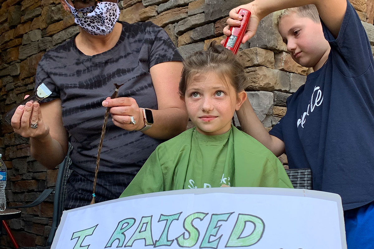 child donating hair